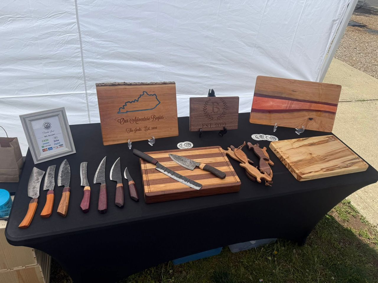 Market display — boards and hand-forged knives